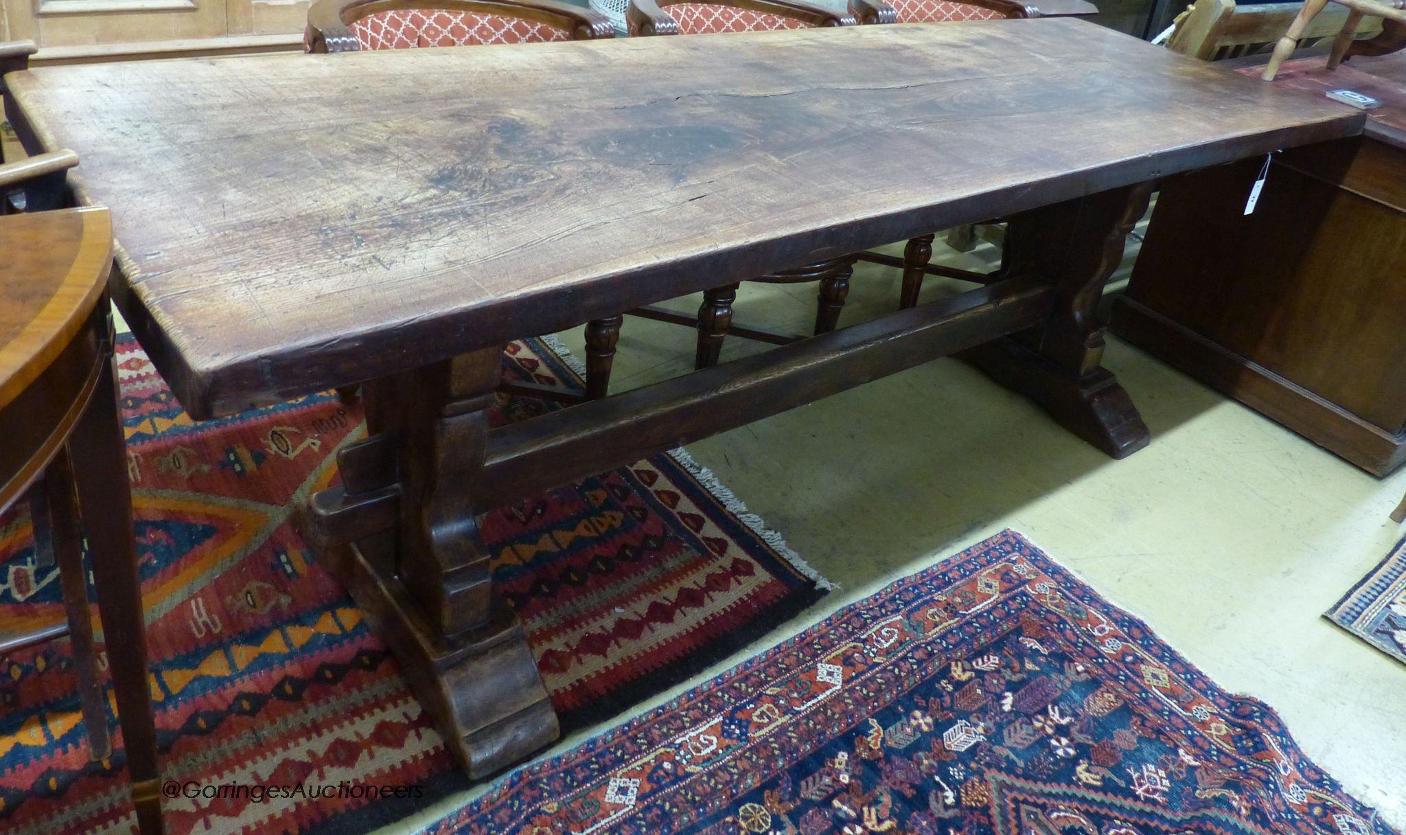 An 18th century style rectangular oak refectory dining table, length 239cm, width 77cm, height 81cm